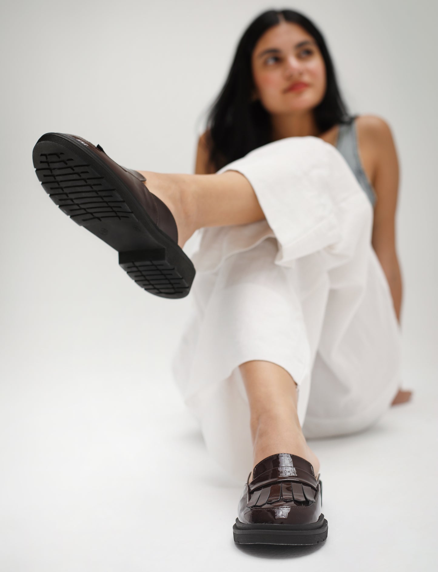 Loafer-style mules in patent maroon