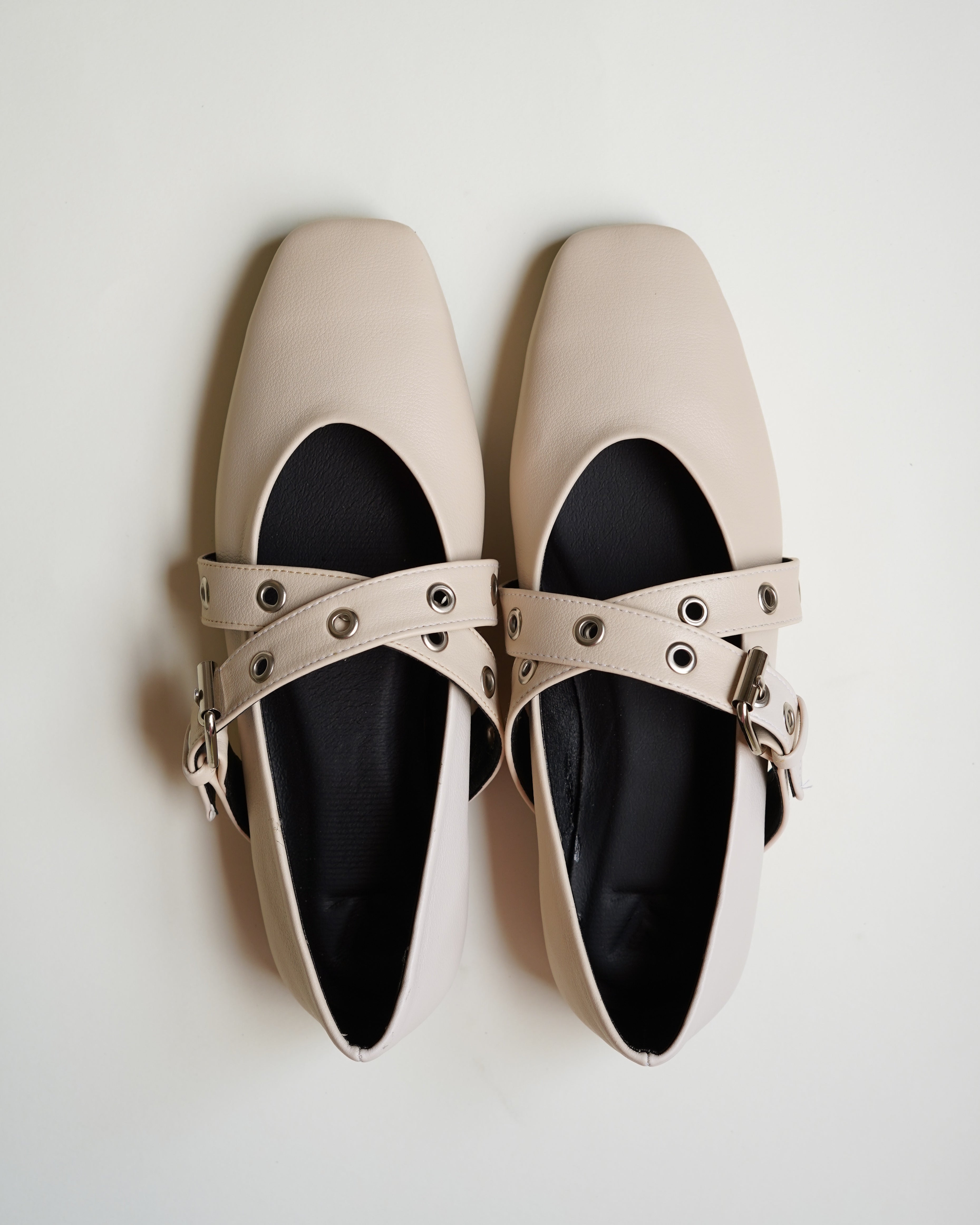 Cross strap beige flats